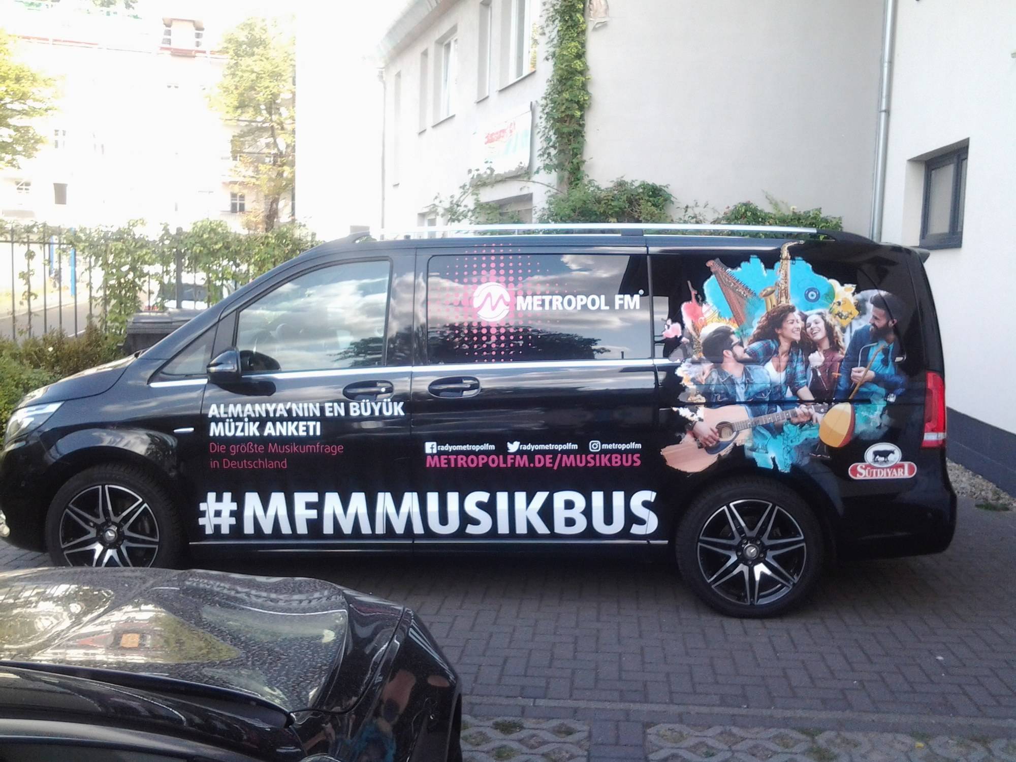 Black van with full wrap “#MFMMUSIKBUS” for Metropol FM